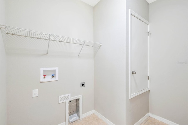 clothes washing area with washer hookup and hookup for an electric dryer