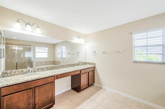 bathroom featuring vanity, tile patterned floors, and walk in shower