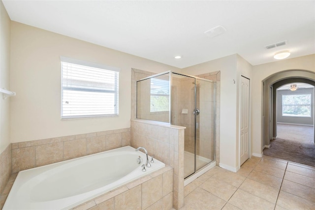 bathroom featuring tile patterned floors and plus walk in shower