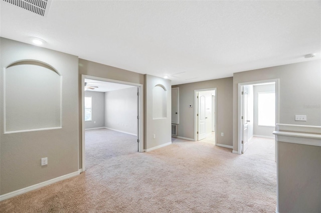 empty room with light colored carpet