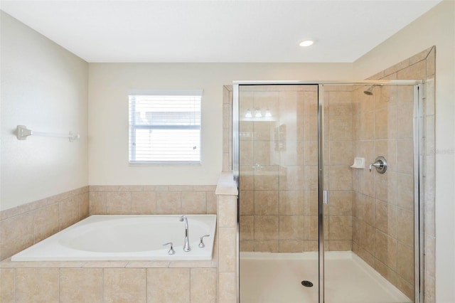 bathroom with separate shower and tub