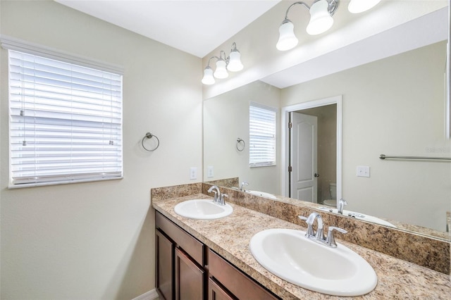 bathroom featuring vanity and toilet