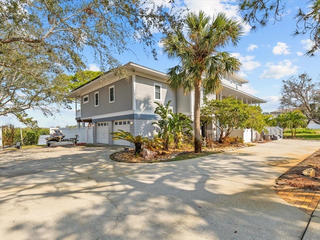 view of side of home with a garage