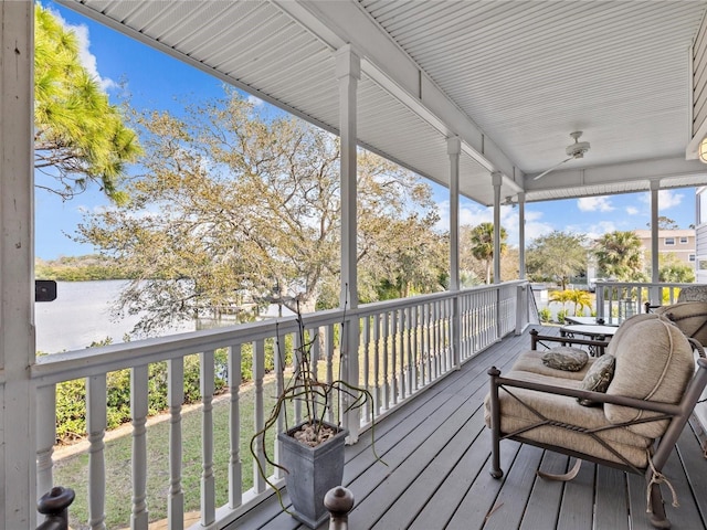 wooden deck featuring a water view