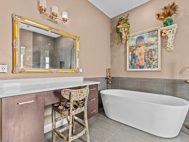 bathroom featuring independent shower and bath, tile walls, and tile patterned floors