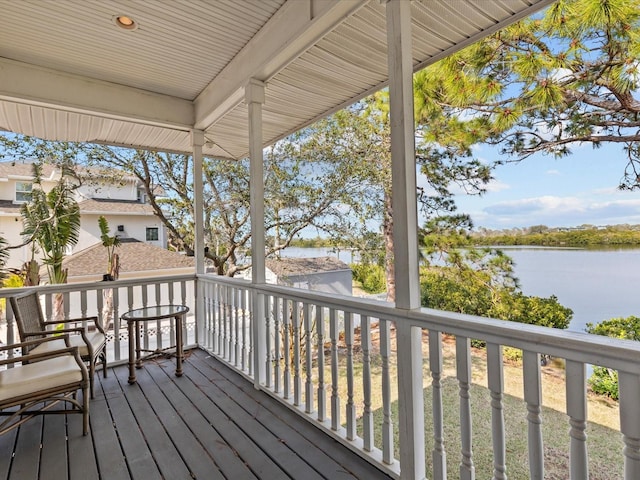 wooden terrace with a water view