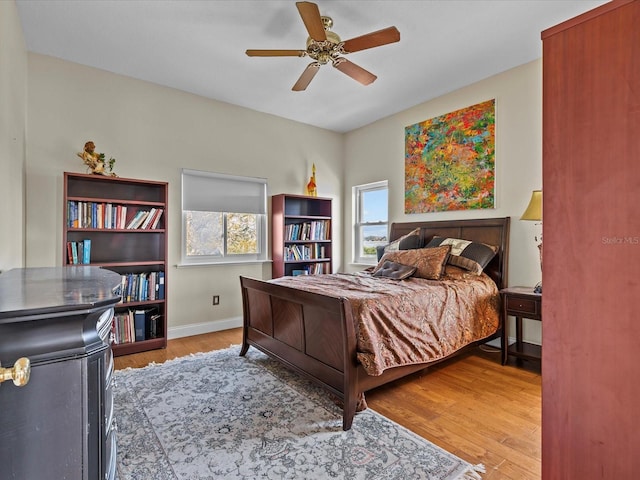 bedroom featuring hardwood / wood-style floors and ceiling fan