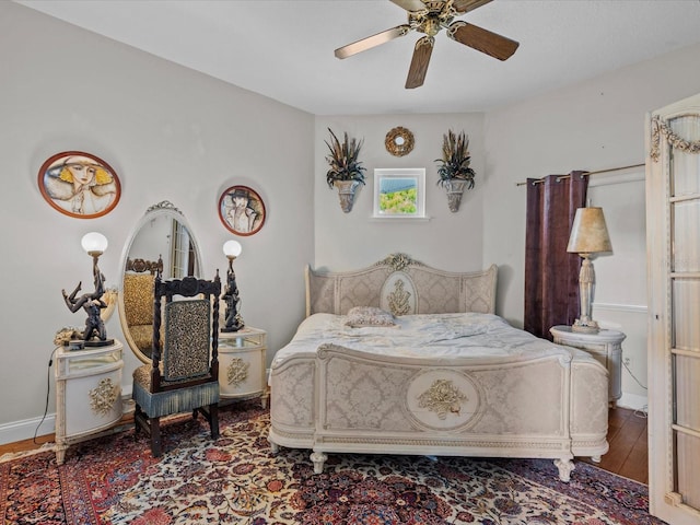 bedroom featuring wood-type flooring and ceiling fan