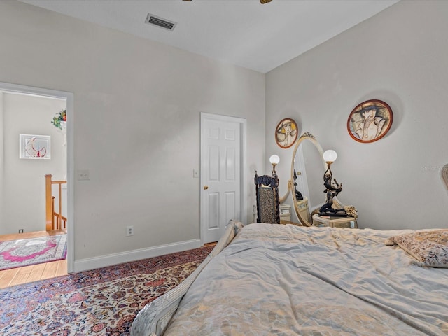 bedroom with hardwood / wood-style floors