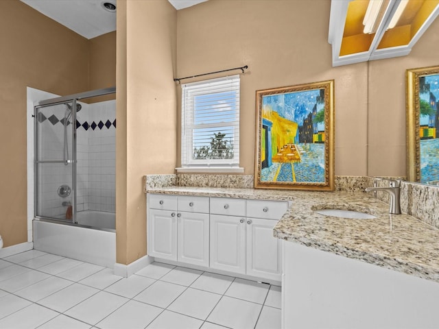 bathroom with vanity, tile patterned floors, and combined bath / shower with glass door