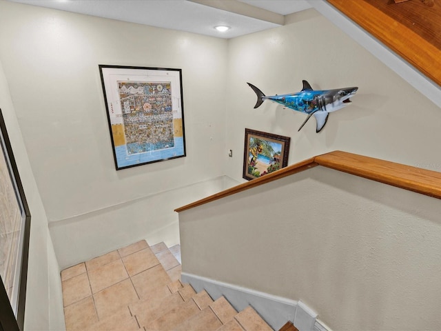 staircase featuring tile patterned flooring