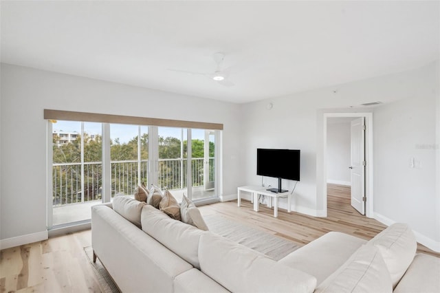 960 Starkey Rd Unit 10301, Largo, FL 33771 - living room with baseboards, ceiling fan, visible vents, and light wood finished floors