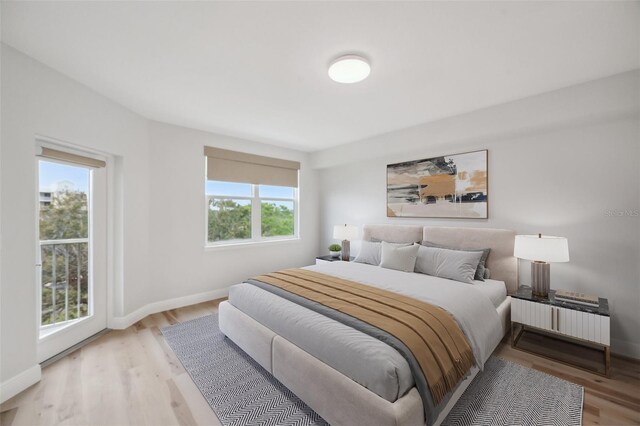 960 Starkey Rd Unit 10301, Largo, FL 33771 - bedroom with light wood-type flooring and baseboards