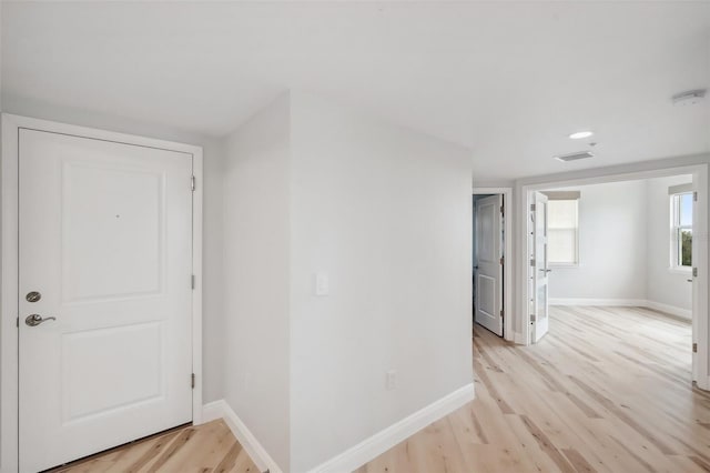 960 Starkey Rd Unit 10301, Largo, FL 33771 - hall with light wood finished floors, baseboards, and visible vents