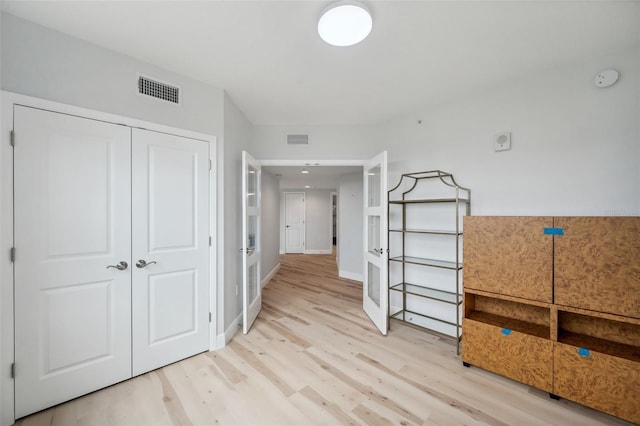 960 Starkey Rd Unit 10301, Largo, FL 33771 - hallway with light wood-style floors, baseboards, and visible vents