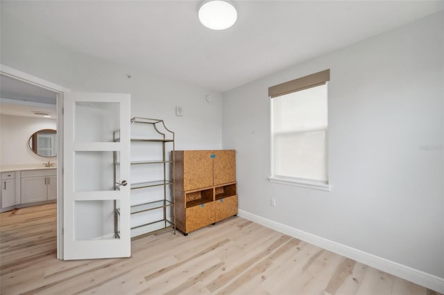 960 Starkey Rd Unit 10301, Largo, FL 33771 - bedroom featuring light wood finished floors and baseboards