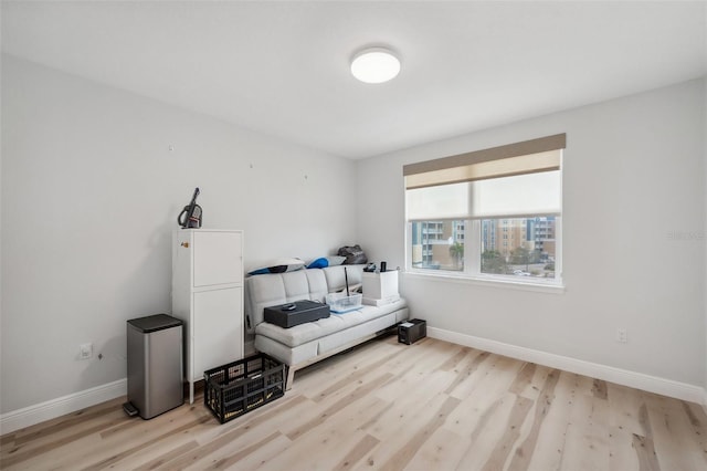 960 Starkey Rd Unit 10301, Largo, FL 33771 - bedroom featuring a city view, light wood finished floors, and baseboards