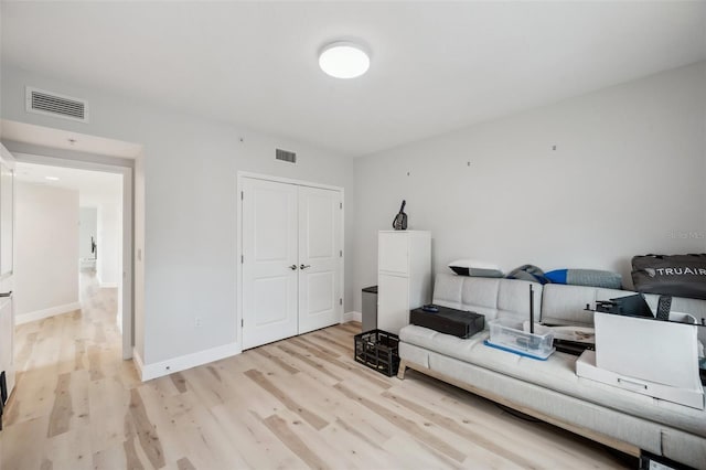 960 Starkey Rd Unit 10301, Largo, FL 33771 - living room featuring light wood finished floors, baseboards, and visible vents