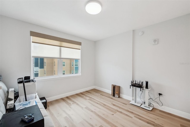 960 Starkey Rd Unit 10301, Largo, FL 33771 - workout room with baseboards and light wood-style floors