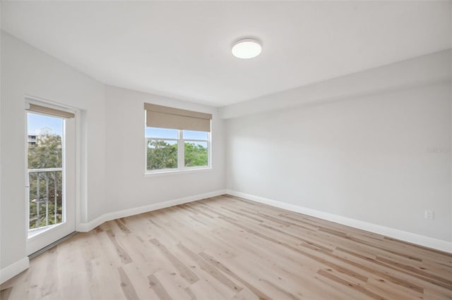960 Starkey Rd Unit 10301, Largo, FL 33771 - unfurnished room with light wood-style flooring and baseboards