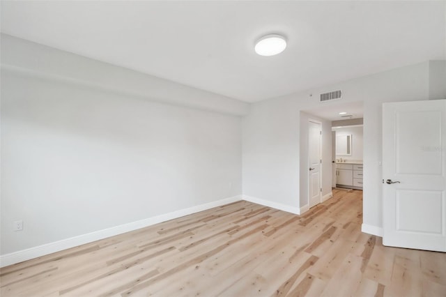 960 Starkey Rd Unit 10301, Largo, FL 33771 - spare room featuring light wood finished floors, baseboards, and visible vents