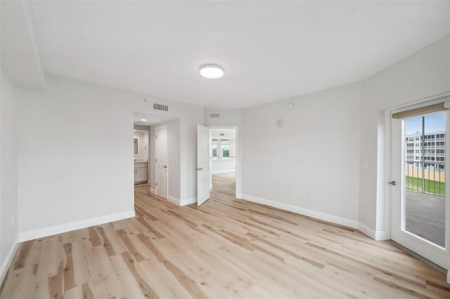 960 Starkey Rd Unit 10301, Largo, FL 33771 - spare room featuring light wood finished floors, baseboards, and visible vents