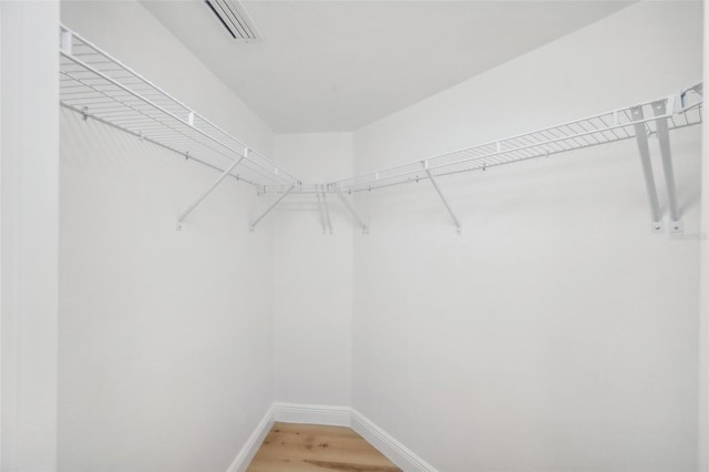 960 Starkey Rd Unit 10301, Largo, FL 33771 - walk in closet with visible vents and wood finished floors