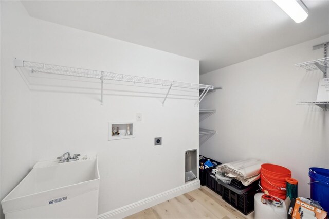 960 Starkey Rd Unit 10301, Largo, FL 33771 - laundry area featuring hookup for a washing machine, laundry area, wood finished floors, baseboards, and electric dryer hookup