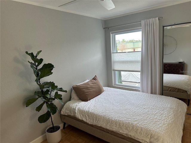 bedroom featuring parquet flooring and ornamental molding