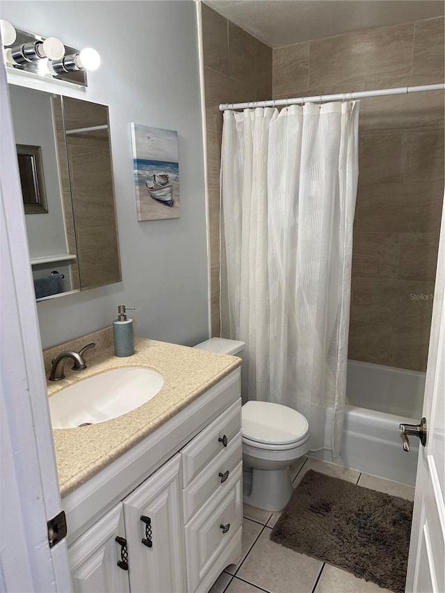 full bathroom with vanity, shower / bath combo, tile patterned floors, and toilet