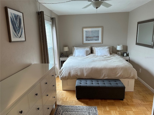 bedroom featuring ceiling fan and light parquet flooring