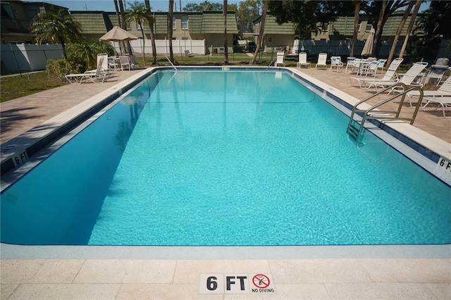 view of pool featuring a patio