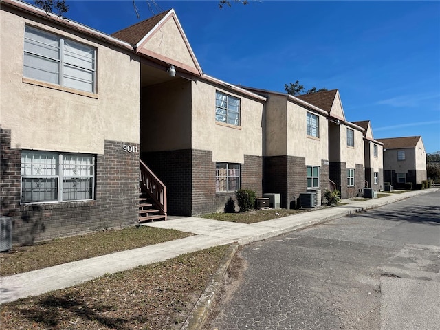 view of property featuring central AC unit