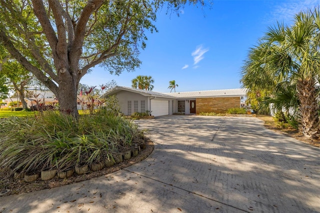 single story home featuring a garage