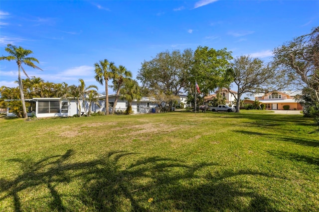 view of yard featuring a sunroom