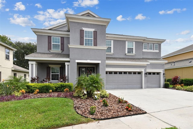 view of front facade with a garage and a front yard