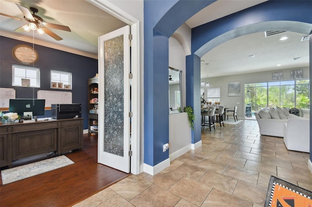 interior space with dark brown cabinets, ceiling fan, and light wood-type flooring