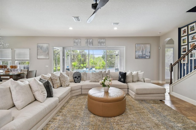 living room featuring a textured ceiling