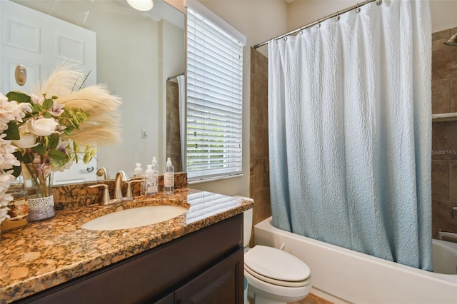 full bathroom with vanity, shower / bath combination with curtain, and toilet