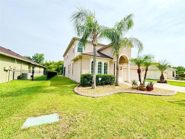 view of front of property featuring a garage and a front yard