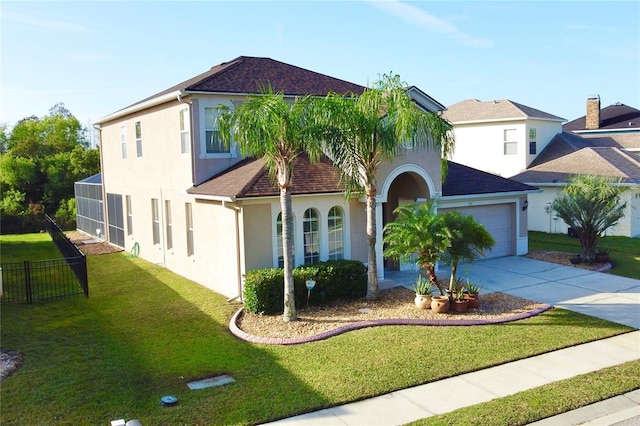 view of front of house with a garage and a front lawn