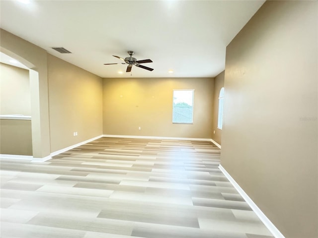 unfurnished room with light hardwood / wood-style floors and ceiling fan