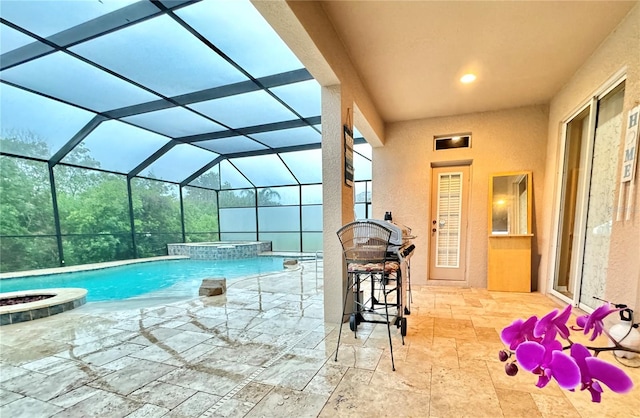 view of pool featuring an in ground hot tub, a lanai, and a patio area