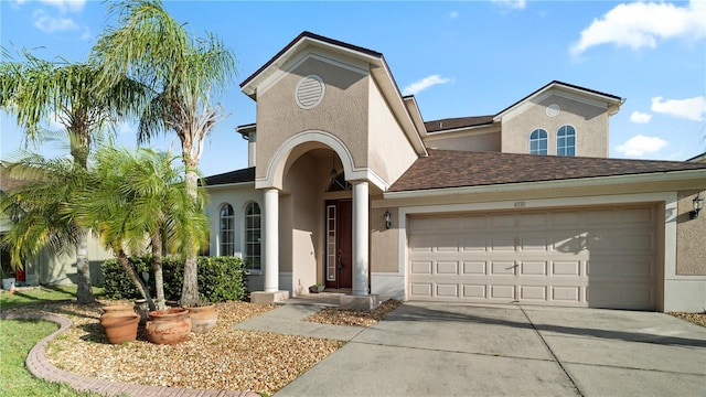 4110 Huntingdale Ct, Wesley Chapel, FL 33543 - view of front of home featuring stucco siding, driveway, an attached garage, and a shingled roof