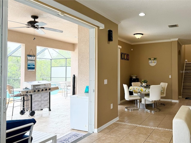 4110 Huntingdale Ct, Wesley Chapel, FL 33543 - dining area with ceiling fan, baseboards, light tile patterned floors, ornamental molding, and stairs