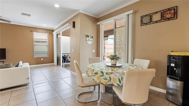 4110 Huntingdale Ct, Wesley Chapel, FL 33543 - tiled dining room with crown molding, plenty of natural light, baseboards, and recessed lighting