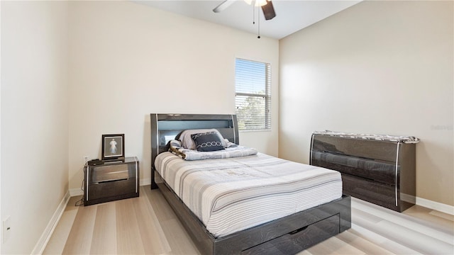 4110 Huntingdale Ct, Wesley Chapel, FL 33543 - bedroom featuring light wood-style floors, baseboards, and ceiling fan