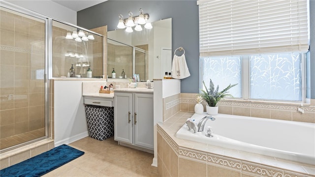 4110 Huntingdale Ct, Wesley Chapel, FL 33543 - bathroom featuring a garden tub, vanity, a stall shower, and tile patterned flooring