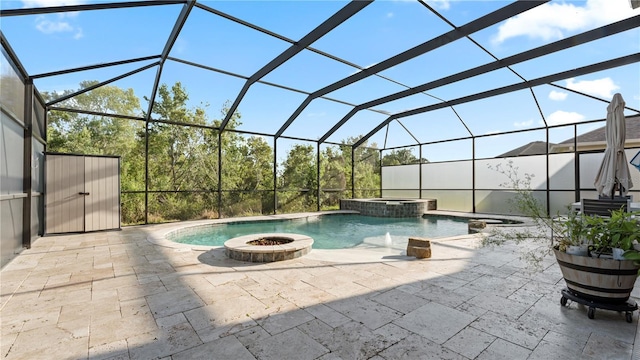4110 Huntingdale Ct, Wesley Chapel, FL 33543 - view of pool featuring a patio area, glass enclosure, an outdoor fire pit, and a pool with connected hot tub