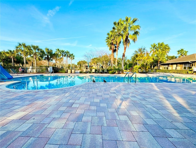 4110 Huntingdale Ct, Wesley Chapel, FL 33543 - community pool with a patio